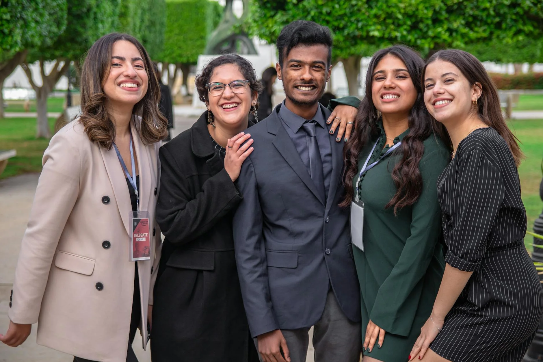 Diverse Group Smiling: A Joyful Campus Gathering