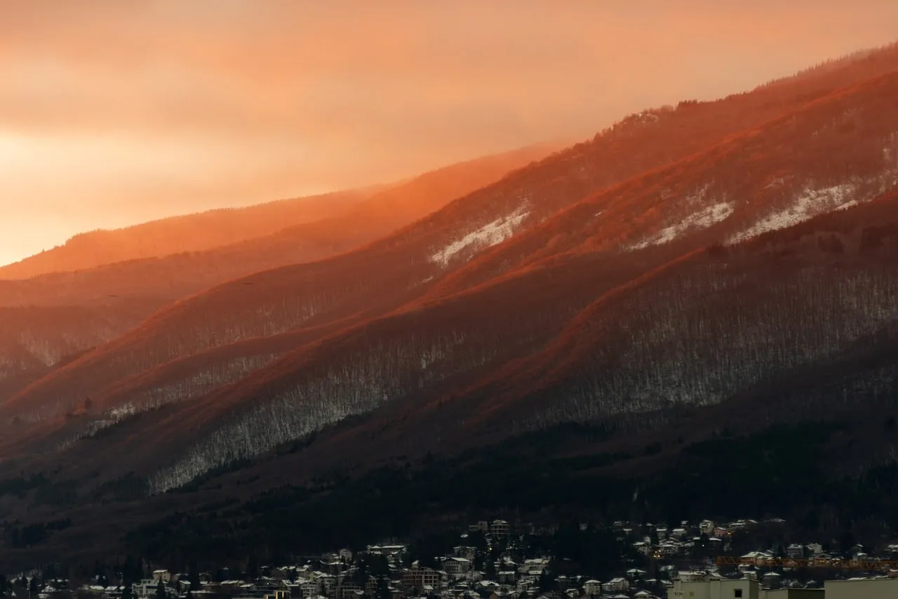 Breathtaking Autumn Dawn Over Foggy Mountain Slopes