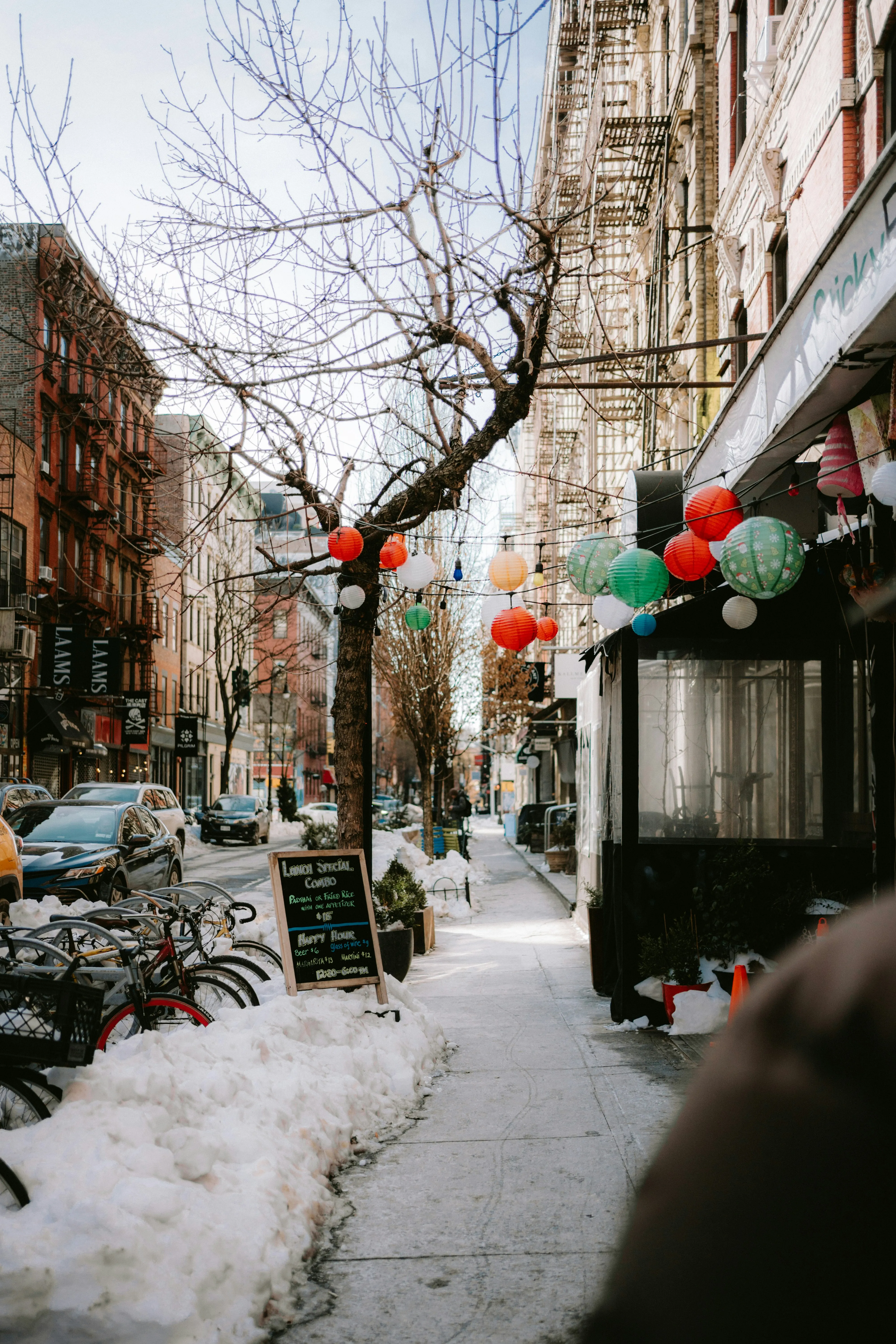Vibrant Lanterns Adorn Snowy City Streetscape