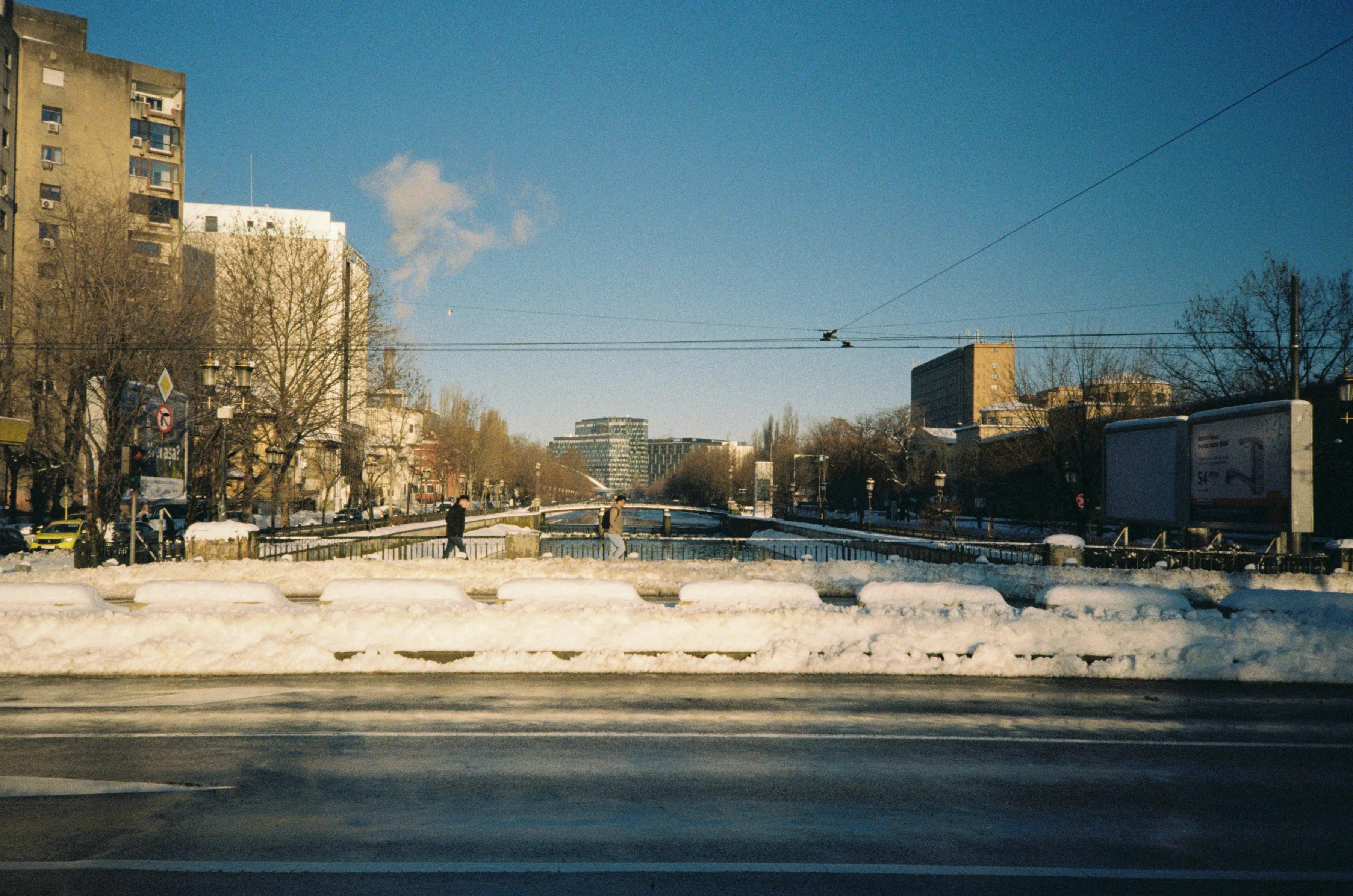 Winter's Embrace: Snowy Urban Vista on Film