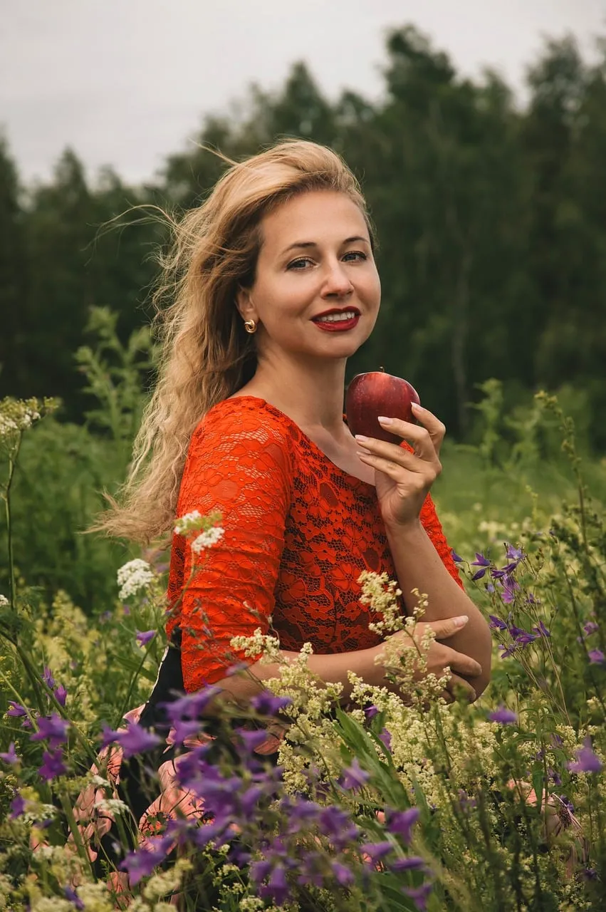 Radiant Beauty in Red: Summer Field Portrait